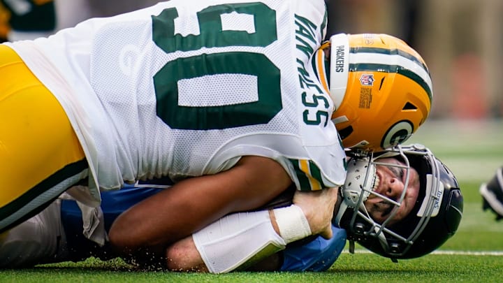 Tennessee Titans quarterback Will Levis (8) is sacked by Green Bay Packers defensive end Lukas Van Ness.