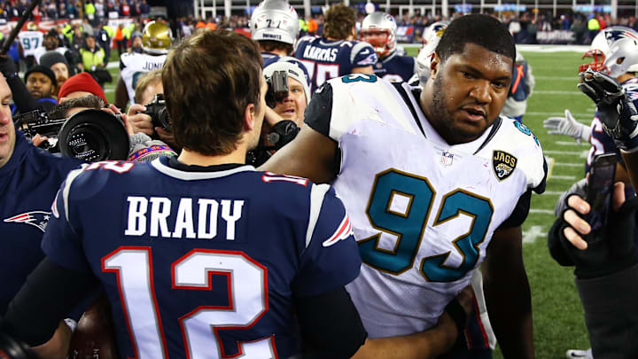 Jan 21, 2018; Foxborough, MA, USA; New England Patriots quarterback Tom Brady (12) greets Jacksonville Jaguars defensive end Calais Campbell (93) following the AFC Championship at Gillette Stadium. Mandatory Credit: Mark J. Rebilas-Imagn Images