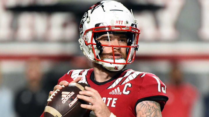 Oct 8, 2022; Raleigh, North Carolina, USA; North Carolina State Wolfpack quarterback Devin Leary (13) looks to throw during the first half against the Florida State Seminoles at Carter-Finley Stadium. Mandatory Credit: Rob Kinnan-Imagn Images