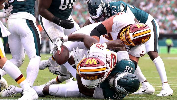 Sep 13, 2026; Philadelphia, Pennsylvania, USA;  Washington Commanders running back Jacory Croskey-Merritt (22) scores a touchdown against Philadelphia Eagles linebacker Jalyx Hunt (58) during the first half at Lincoln Financial Field.  Mandatory Credit: Bill Streicher-Imagn Images