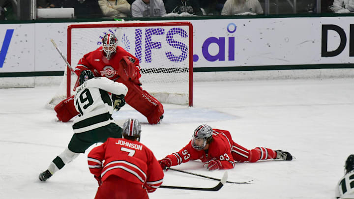 MSU's Mikey DeAngelo shoots against Ohio State goalkeeper Logan Terness, Saturday, March 22, 2025, during the first period of the Big 10 Hockey final at Munn Ice Arena. MSU won 4-3 in double overtime.