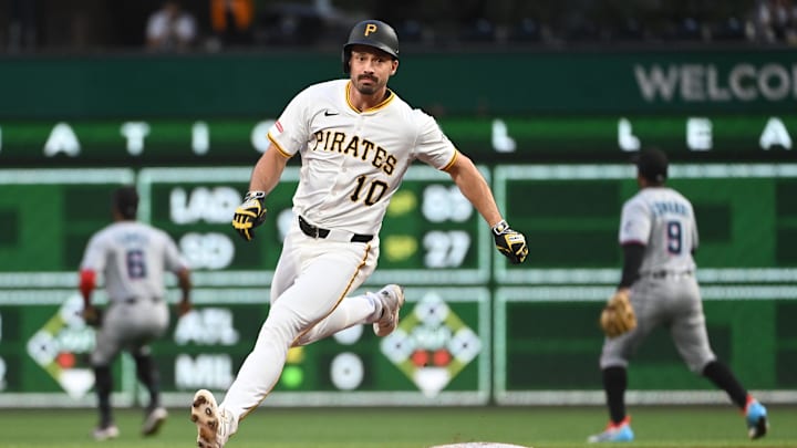 Jun 9, 2025; Pittsburgh, Pennsylvania, USA;  Pittsburgh Pirates Bryan Reynolds (10) races to third base for a bases clearing triple against the Florida Marlins during the third inning at PNC Park. Mandatory Credit: Philip G. Pavely-Imagn Images