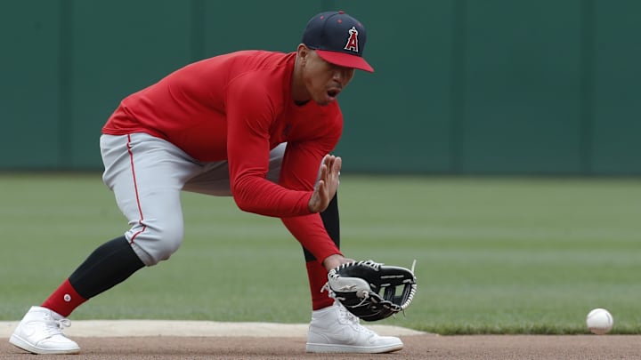 May 6, 2024; Pittsburgh, Pennsylvania, USA; Los Angeles Angels infielder Ehire Adrianza (13) takes ground balls before the game against the Pittsburgh Pirates at PNC Park. Mandatory Credit: Charles LeClaire-Imagn Images May 6, 2024; Pittsburgh, Pennsylvania, USA; Los Angeles Angels infielder Ehire Adrianza (13) takes ground balls before the game against the Pittsburgh Pirates at PNC Park. Mandatory Credit: Charles LeClaire-Imagn Images