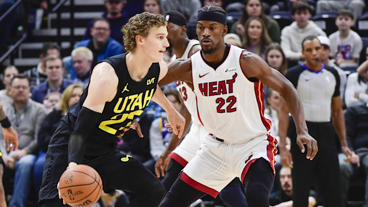 Dec 31, 2022; Salt Lake City, Utah, USA; Miami Heat forward Jimmy Butler (22) defends Utah Jazz forward/center Lauri Markkanen (23) during the first half at Vivint Arena. Mandatory Credit: Christopher Creveling-Imagn Images