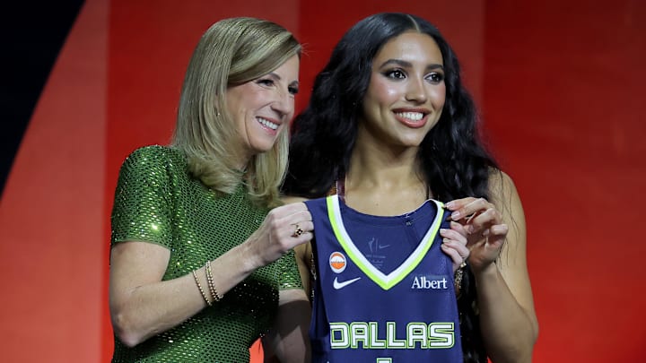 WNBA Commissioner Cathy Engelbert (left) poses for photos with Azzi Fudd
