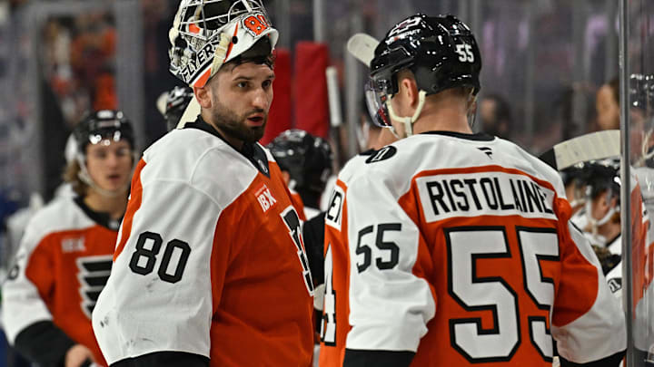 Dec 22, 2025; Philadelphia, Pennsylvania, USA; Philadelphia Flyers goaltender Dan Vladar (80) talks with defenseman Rasmus Ristolainen (55) durijnga timeout against the Vancouver Canucks at Xfinity Mobile Arena. Mandatory Credit: Eric Hartline-Imagn Images Dec 22, 2025; Philadelphia, Pennsylvania, USA; Philadelphia Flyers goaltender Dan Vladar (80) talks with defenseman Rasmus Ristolainen (55) durijnga timeout against the Vancouver Canucks at Xfinity Mobile Arena. Mandatory Credit: Eric Hartline-Imagn Images
