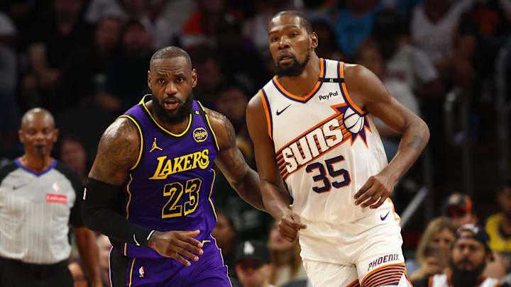 Oct 28, 2024; Phoenix, Arizona, USA; Los Angeles Lakers forward LeBron James (23) against Phoenix Suns forward Kevin Durant (35) at Footprint Center. Mandatory Credit: Mark J. Rebilas-Imagn Images