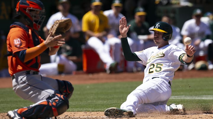 Jul 27, 2022; Oakland, California, USA; Oakland Athletics left fielder Stephen Piscotty (25) slides
