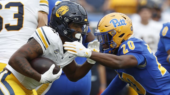 Oct 12, 2024; Pittsburgh, Pennsylvania, USA;  California Golden Bears running back Kadarius Calloway (2) runs the ball against Pittsburgh Panthers linebacker Jordan Bass (20) during the second quarter at Acrisure Stadium. Mandatory Credit: Charles LeClaire-Imagn Images