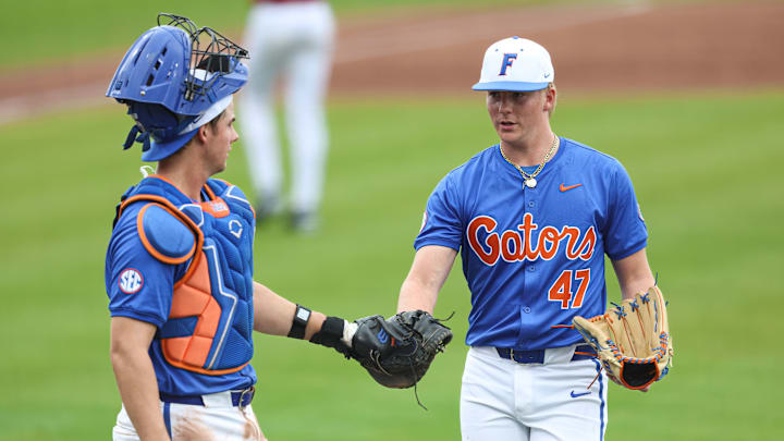 Florida Gators catcher Luke Heyman and pitcher Aidan King during the team's win over Harvard in the first game of Saturday's double-header.