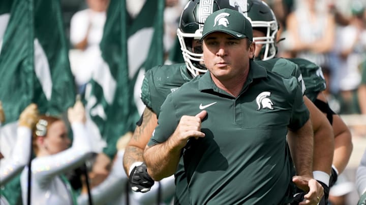 Sep 13, 2025; East Lansing, Michigan, USA; Michigan State head coach Jonathan Smith takes the field before a game against Youngstown State at Spartan Stadium. Mandatory Credit: Brendan Mullin-Imagn Images