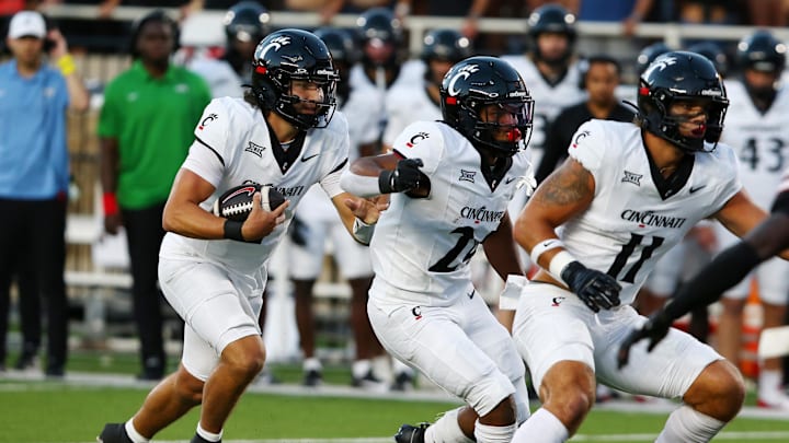 Sep 28, 2024; Lubbock, Texas, USA;  Cincinnati Bearcats quarterback Brendan Sorsby (2) rushes against the Texas Tech Red Raiders in the first half at Jones AT&T Stadium and Cody Campbell Field. Mandatory Credit: Michael C. Johnson-Imagn Images