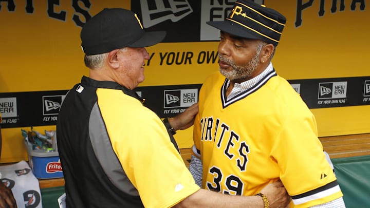 Pittsburgh Pirates manager Clint Hurdle (left) greets Pirates former right fielder Dave Parker (39) in the dugout before playing the Baltimore Orioles at PNC Park. The Pirates won 9-8. 