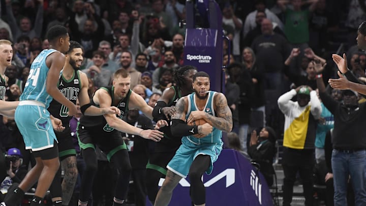 Nov 20, 2023; Charlotte, North Carolina, USA; Charlotte Hornets forward Miles Bridges (0) gets a