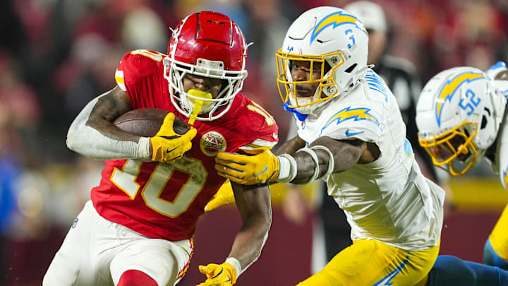 Dec 8, 2024; Kansas City, Missouri, USA; Kansas City Chiefs running back Isiah Pacheco (10) runs the ball against Los Angeles Chargers safety Derwin James Jr. (3) during the second half at GEHA Field at Arrowhead Stadium. Mandatory Credit: Jay Biggerstaff-Imagn Images
