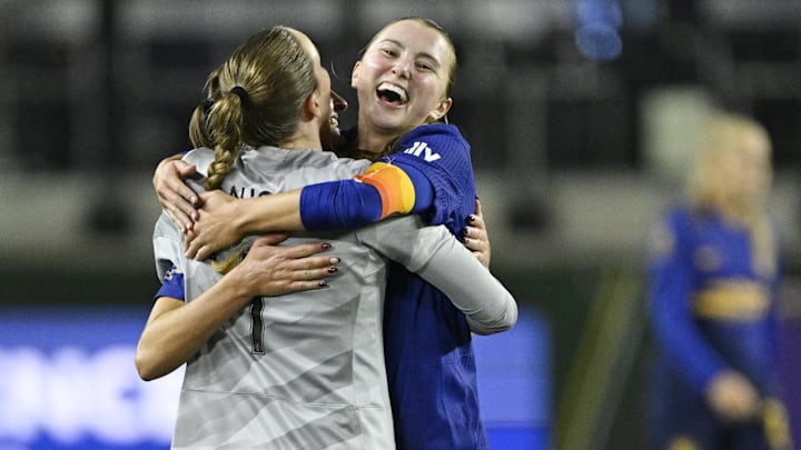 Utah Royals FC goalkeeper Mandy Haught (1) hugs defender Kate Del Fava (8) during the second half at Providence Park 