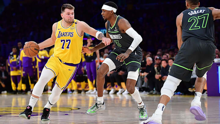 Apr 30, 2025; Los Angeles, California, USA; Los Angeles Lakers guard Luka Doncic (77) moves the ball against Minnesota Timberwolves forward Jaden McDaniels (3) during the first half in game five of first round for the 2025 NBA Playoffs at Crypto.com Arena. Mandatory Credit: Gary A. Vasquez-Imagn Images Apr 30, 2025; Los Angeles, California, USA; Los Angeles Lakers guard Luka Doncic (77) moves the ball against Minnesota Timberwolves forward Jaden McDaniels (3) during the first half in game five of first round for the 2025 NBA Playoffs at Crypto.com Arena. Mandatory Credit: Gary A. Vasquez-Imagn Images