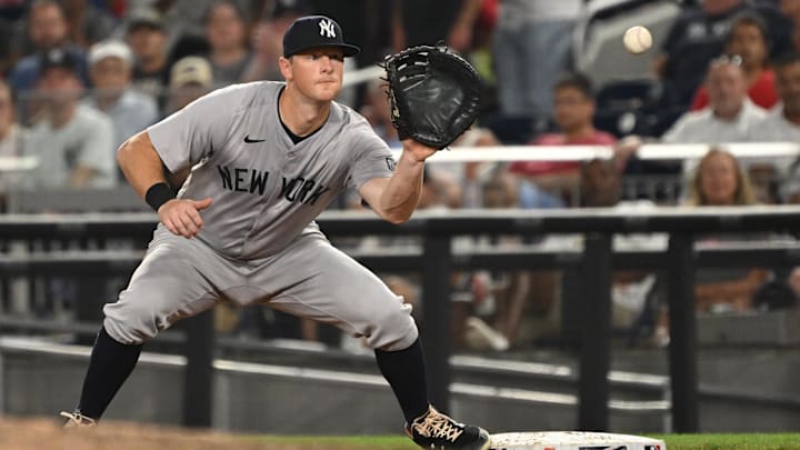 Aug 27, 2024; Washington, District of Columbia, USA; New York Yankees third baseman DJ LeMahieu (26) fields the ball at first base against the Washington Nationals during the sixth inning at Nationals Park.