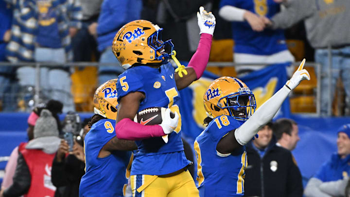 Oct 24, 2024; Pittsburgh, Pennsylvania, USA; Pittsburgh Panthers defensive back Phillip O'Brien Jr. (5) celebrates an interception against the Syracuse Orange during the third quarter at Acrisure Stadium. Mandatory Credit: Barry Reeger-Imagn Images
