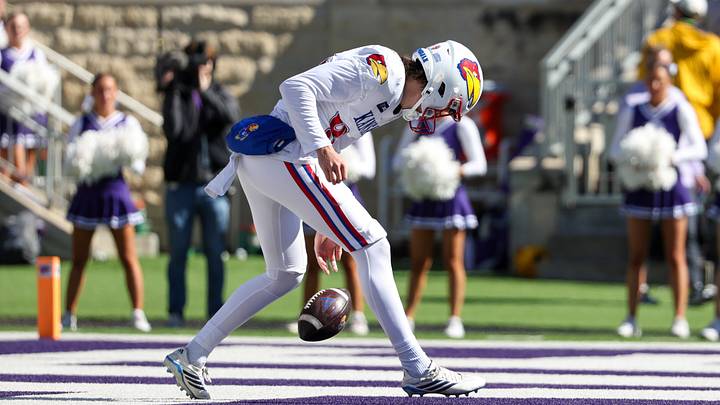 Kansas Jayhawks punter Matthew Gill (99) drops a snap in the end zone against Kansas State Kansas Jayhawks punter Matthew Gill (99) drops a snap in the end zone against Kansas State