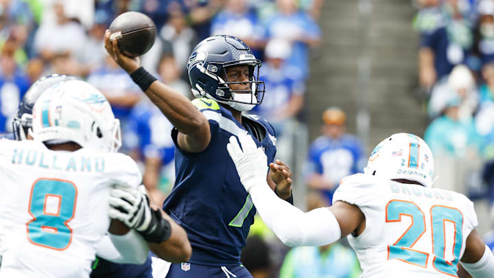 Sep 22, 2024; Seattle, Washington, USA; Seattle Seahawks quarterback Geno Smith (7) passes against the Miami Dolphins during the second quarter at Lumen Field. Sep 22, 2024; Seattle, Washington, USA; Seattle Seahawks quarterback Geno Smith (7) passes against the Miami Dolphins during the second quarter at Lumen Field.