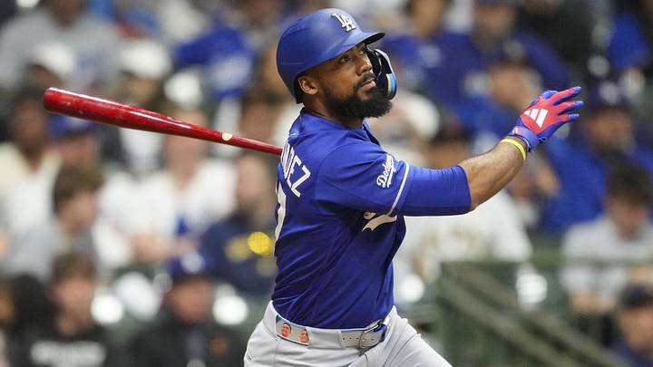 May 23, 2026; Milwaukee, Wisconsin, USA;  Los Angeles Dodgers left fielder Teoscar Hernandez (37) hits an RBI single during the ninth inning against the Milwaukee Brewers at American Family Field. Mandatory Credit: Jeff Hanisch-Imagn Images