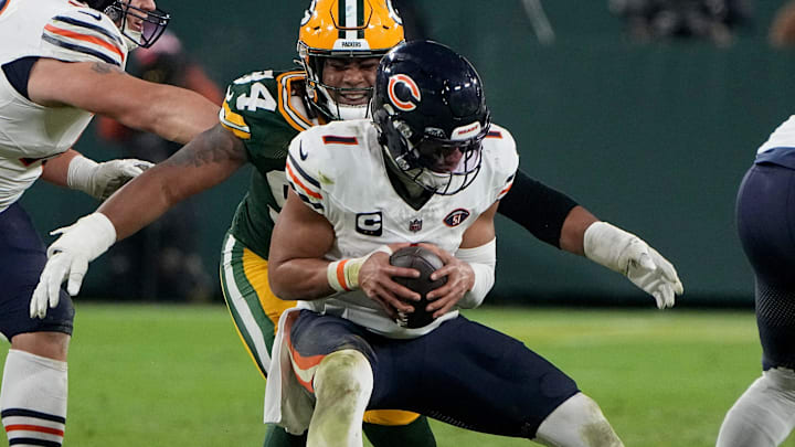 Green Bay Packers defensive end Karl Brooks (94) sacks Chicago Bears quarterback Justin Fields (1) during the fourth quarter of their game Sunday, January 7, 2024 at Lambeau Field in Green Bay, Wisconsin. The Green Bay Packers beat the Chicago Bears 17-9.