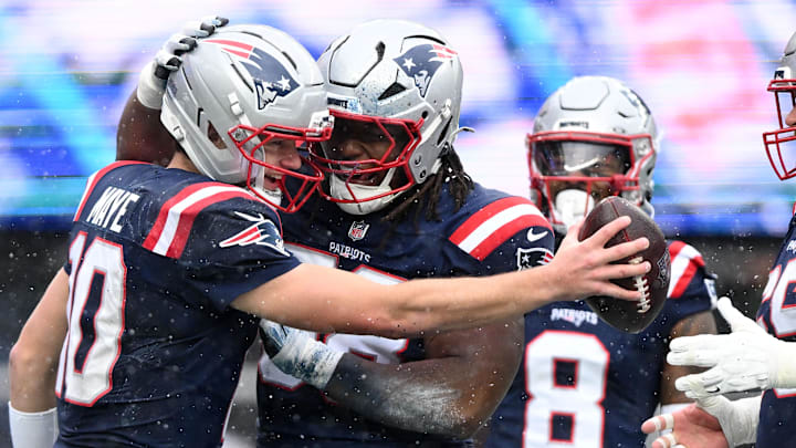 Dec 14, 2025; Foxborough, Massachusetts, USA; New England Patriots quarterback Drake Maye (10) celebrates with his teammates after scoring a touchdown against the Buffalo Bills during the first half at Gillette Stadium. Mandatory Credit: Brian Fluharty-Imagn Images