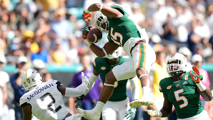Nov 6, 2021; Miami Gardens, Florida, USA; Miami Hurricanes safety Avantae Williams (15) intercepts a pass intended for Georgia Tech Yellow Jackets wide receiver Kyric McGowan (2) during the first half at Hard Rock Stadium. Mandatory Credit: Jasen Vinlove-Imagn Images