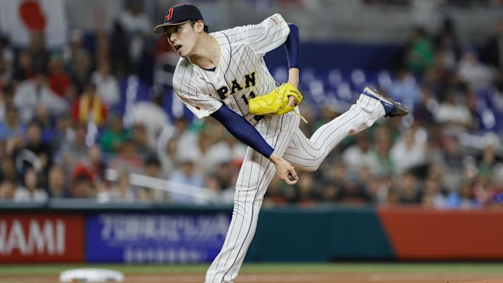 Mar 20, 2023; Miami, Florida, USA; Japan starting pitcher Roki Sasaki (14) delivers a pitch during the first inning against Mexico at LoanDepot Park. Mar 20, 2023; Miami, Florida, USA; Japan starting pitcher Roki Sasaki (14) delivers a pitch during the first inning against Mexico at LoanDepot Park.