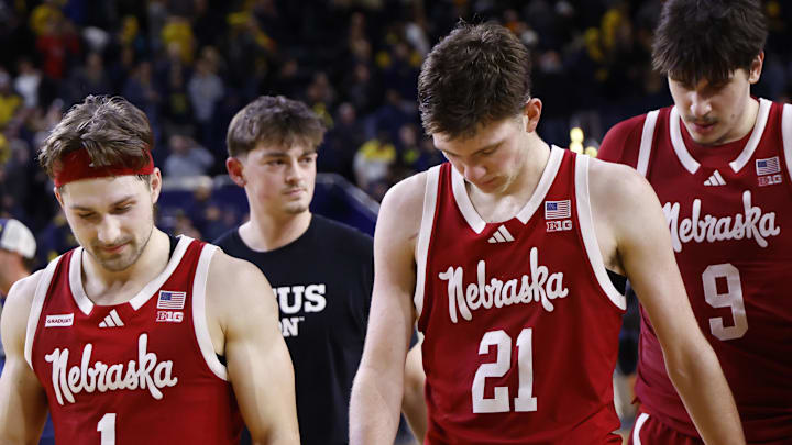 Nebraska guard Sam Hoiberg, forward Pryce Sandfort (21) and forward Berke Buyuktuncel (9) walk off after the loss to Michigan.