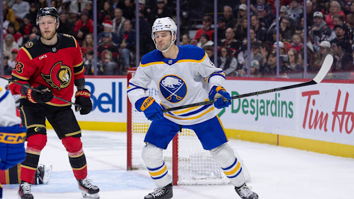 Dec 23, 2025; Ottawa, Ontario, CAN; Ottawa Senators defenseman Nikolas Matinpalo (33) and Buffalo Sabres center josh Norris (9) follow the puck in the second period at the Canadian Tire Centre. Mandatory Credit: Marc DesRosiers-IMAGN Images