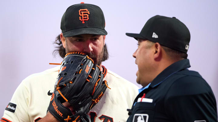 San Francisco Giants starting pitcher Robbie Ray talks with home plate umpire Nestor Ceja. San Francisco Giants starting pitcher Robbie Ray talks with home plate umpire Nestor Ceja.