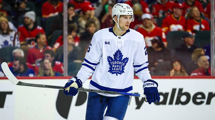 Feb 2, 2026; Calgary, Alberta, CAN; Toronto Maple Leafs defenseman Brandon Carlo (25) against the Calgary Flames during the second period at Scotiabank Saddledome. Mandatory Credit: Sergei Belski-Imagn Images