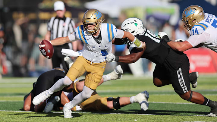 Aug 31, 2024; Honolulu, Hawaii, USA; UCLA Bruins quarterback Ethan Garbers (4) scrambles away from Hawaii Rainbow Warriors defensive lineman Dion Washington (19) during the fourth quarter of an NCAA college football game at the Clarence T.C. Ching Athletics Complex. Mandatory Credit: Marco Garcia-Imagn Images Aug 31, 2024; Honolulu, Hawaii, USA; UCLA Bruins quarterback Ethan Garbers (4) scrambles away from Hawaii Rainbow Warriors defensive lineman Dion Washington (19) during the fourth quarter of an NCAA college football game at the Clarence T.C. Ching Athletics Complex. Mandatory Credit: Marco Garcia-Imagn Images