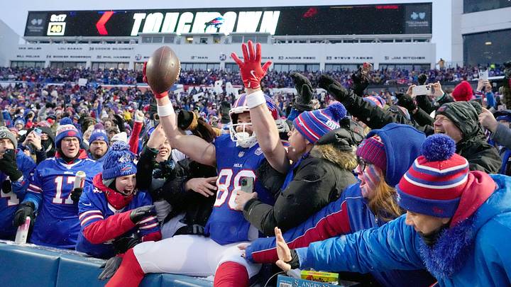 Bills tight end Dawson Knox leaps into the stands to celebrate with fans after scoring the opening touchdown of the game in first quarter against the Jets during the first half of their last regular season game at Highmark Stadium in Orchard Park Sunday, Jan. 4, 2026. Bills tight end Dawson Knox leaps into the stands to celebrate with fans after scoring the opening touchdown of the game in first quarter against the Jets during the first half of their last regular season game at Highmark Stadium in Orchard Park Sunday, Jan. 4, 2026.