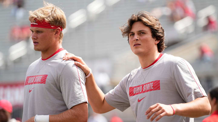 Ohio State quarterbacks Julian Sayin (10) and Lincoln Kienholz (3) warm up prior to the 2024 season opener against the Akron Zips.
