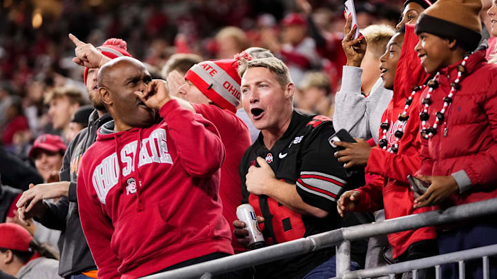 Fans react after Ohio State Buckeyes wide receiver Jeremiah Smith (4) makes a one-handed catch in front of UCLA Bruins defensive back Andre Jordan Jr. (2) during the NCAA football game at Ohio Stadium in Columbus on Nov. 15, 2025.