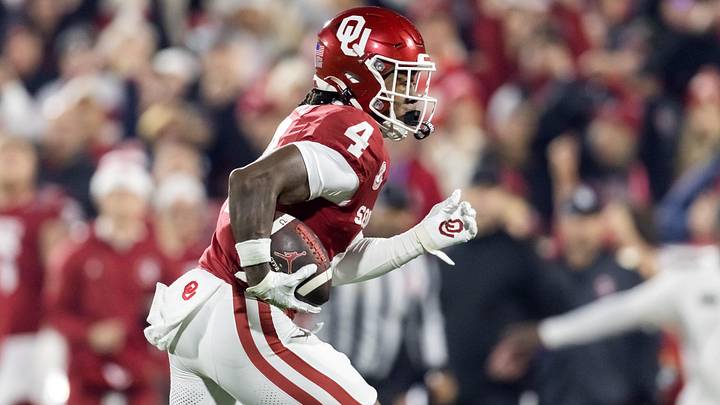 Dec 19, 2025; Norman, OK, USA; Oklahoma Sooners wide receiver Deion Burks (4) against the Alabama Crimson Tide during the CFP National Playoff First Round at Gaylord Family Oklahoma Memorial Stadium. Mandatory Credit: Mark J. Rebilas-Imagn Images