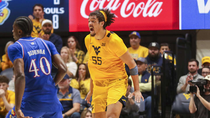 Jan 10, 2026; Morgantown, West Virginia, USA; West Virginia Mountaineers center Harlan Obioha (55) celebrates during the second half against the Kansas Jayhawks at Hope Coliseum. Mandatory Credit: Ben Queen-Imagn Images