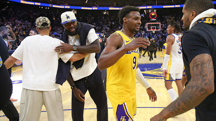 Oct 5, 2025; San Francisco, California, USA; Los Angeles Lakers forward LeBron James (23) greets Golden State Warriors guard Seth Curry while guard Bronny James (9) greets Golden State Warriors guard Gary Payton II (0) after the game at Chase Center. Mandatory Credit: David Gonzales-Imagn Images Oct 5, 2025; San Francisco, California, USA; Los Angeles Lakers forward LeBron James (23) greets Golden State Warriors guard Seth Curry while guard Bronny James (9) greets Golden State Warriors guard Gary Payton II (0) after the game at Chase Center. Mandatory Credit: David Gonzales-Imagn Images