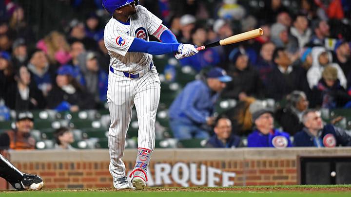 Apr 20, 2024; Chicago, Illinois, USA; Chicago Cubs outfielder Alexander Canario (4) hits a home run during the sixth inning against the Miami Marlins at Wrigley Field.