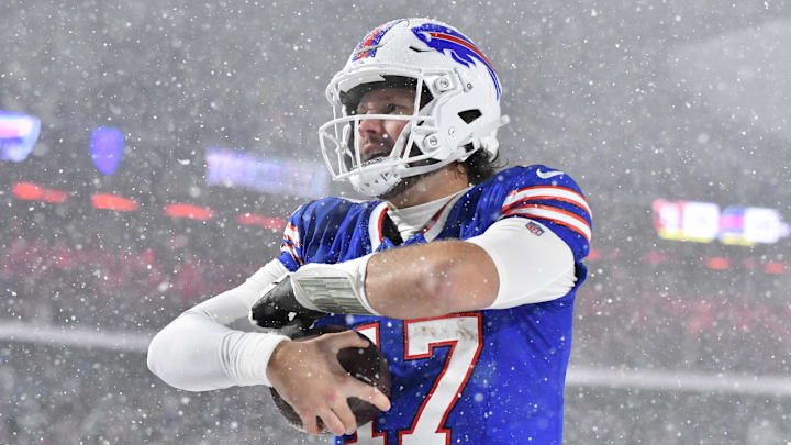 Dec 1, 2024; Orchard Park, New York, USA; Buffalo Bills quarterback Josh Allen (17) reacts to scoring a rushing touchdown against the San Francisco 49ers in the third quarter at Highmark Stadium.