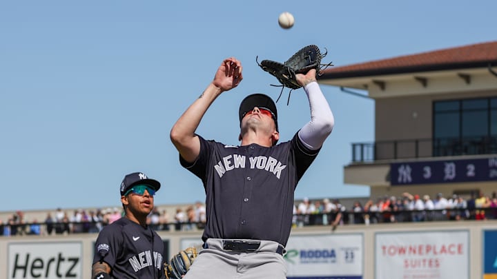 Feb 24, 2024; Lakeland, Florida, USA; New York Yankees first baseman Jordan Groshans (84) catches a fly ball during the second inning against the Detroit Tigers at Publix Field at Joker Marchant Stadium. Mandatory Credit: Mike Watters-Imagn Images