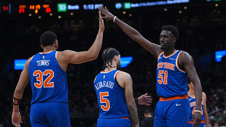 Feb 8, 2026; Boston, Massachusetts, USA; New York Knicks forward Mohamed Diawara (51) and center Karl-Anthony Towns (32) react after a play against the Boston Celtics in the second quarter at TD Garden. Mandatory Credit: David Butler II-Imagn Images