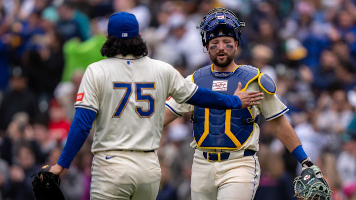 Seattle Mariners catcher Cal Raleigh (right) and closer Andres Munoz celebrate after a win against the Miami Marlins on April 27 at T-Mobile Park