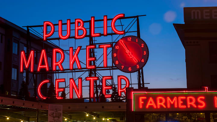 A night photo of the neon sign over the main entrance to the...