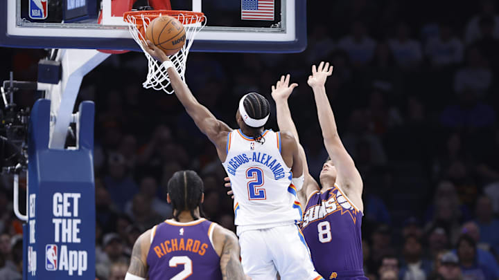 Feb 5, 2025; Oklahoma City, Oklahoma, USA;Oklahoma City Thunder guard Shai Gilgeous-Alexander (2) shoots as Phoenix Suns guard Grayson Allen (8) defends during the second half of a game at Paycom Center. Mandatory Credit: Alonzo Adams-Imagn Images
