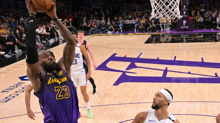 Los Angeles Lakers forward LeBron James (23) goes up for a dunk past Orlando Magic guard Jalen Suggs (4) in the second half at Crypto.com Arena.