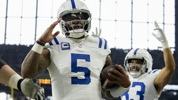 Dec 22, 2024; Indianapolis, Indiana, USA; Indianapolis Colts quarterback Anthony Richardson (5) celebrates after rushing for a touchdown during a game against the Tennessee Titans at Lucas Oil Stadium. Mandatory Credit: Christine Tannous/USA Today Network via Imagn Images 